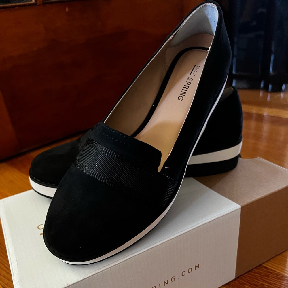 Call It Spring Shoes. Black flats with white soles, size 7. Very comfortable.